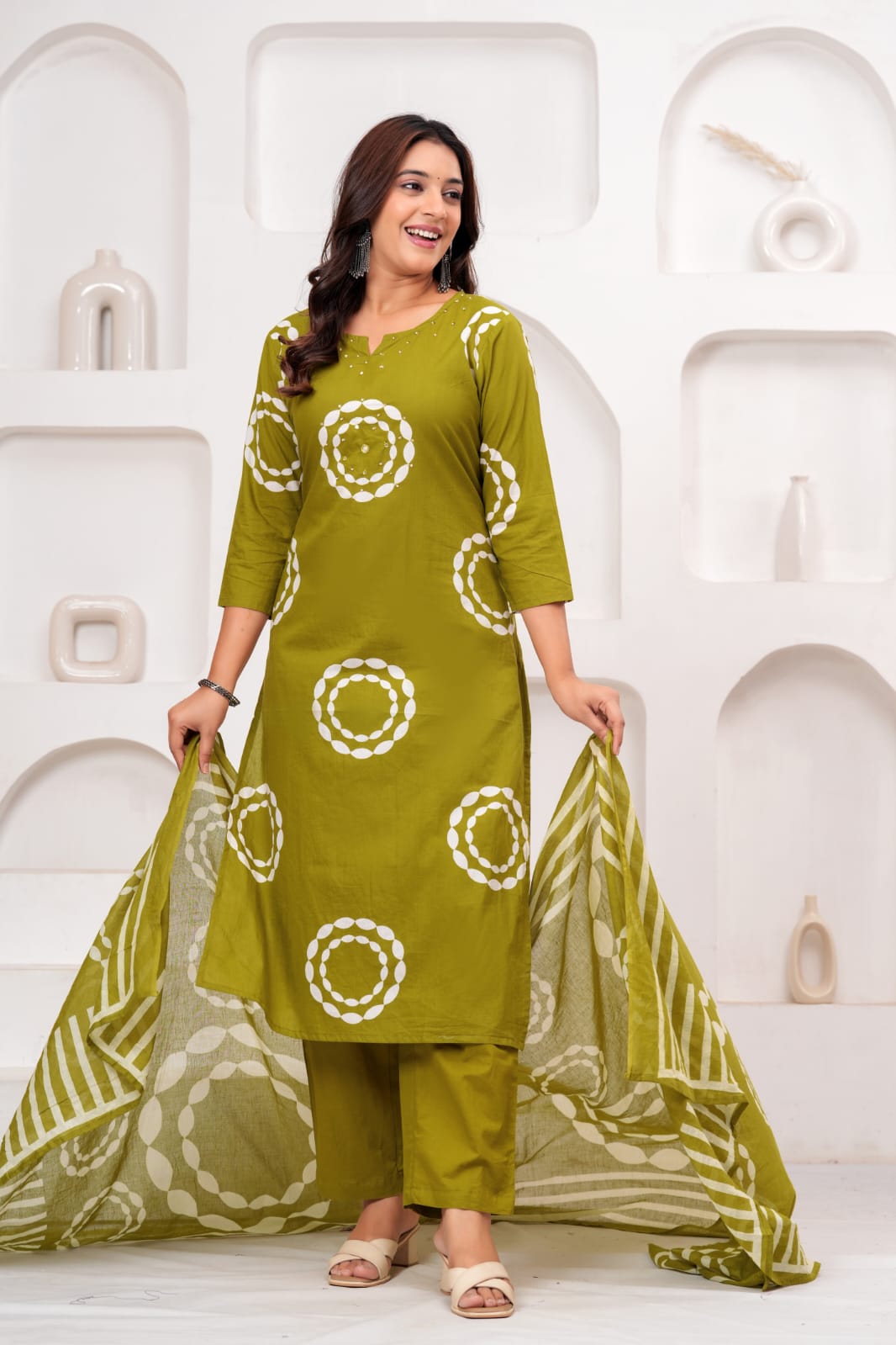 olive green cotton kurta set features white circular patterns