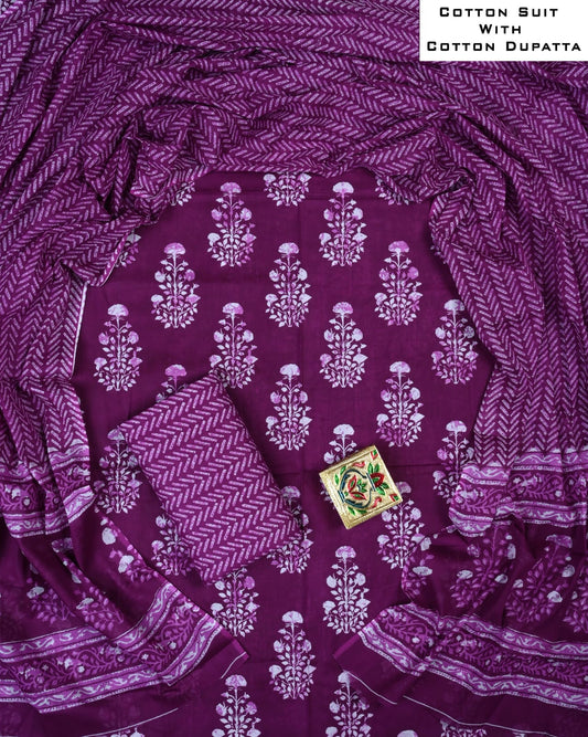Purple cotton suit with white floral patterns and a matching dupatta, featuring a small decorative box.