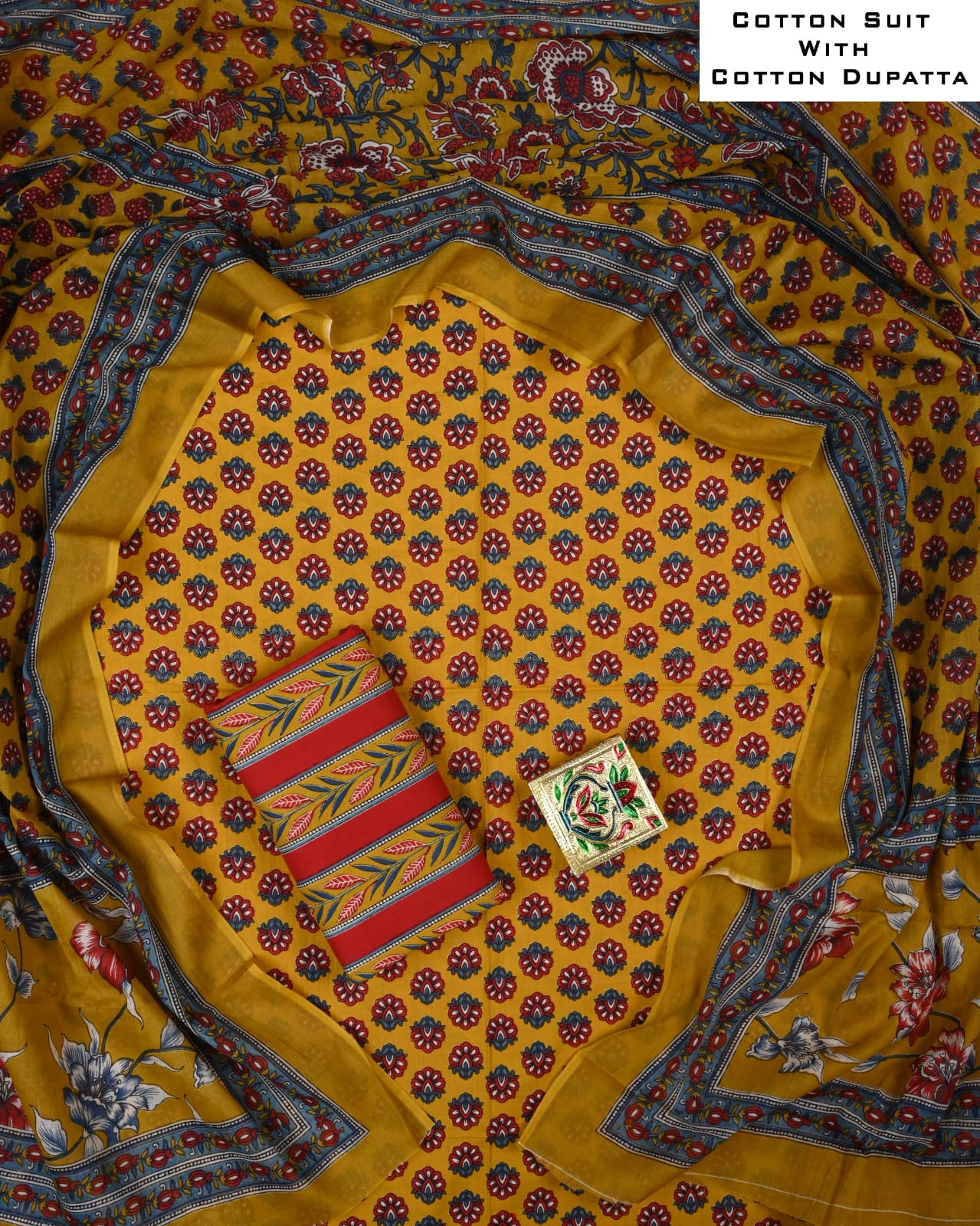 Cotton suit with a yellow dupatta featuring floral patterns on a matching fabric background.