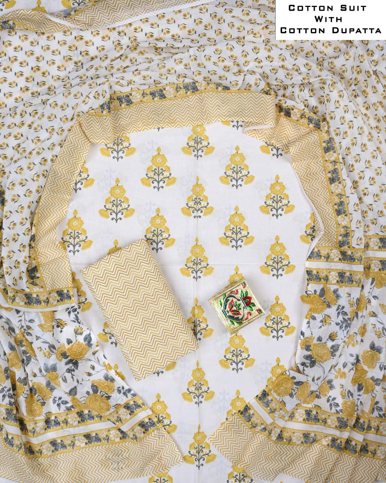 Cotton suit with floral patterns and a matching dupatta on a white background.
