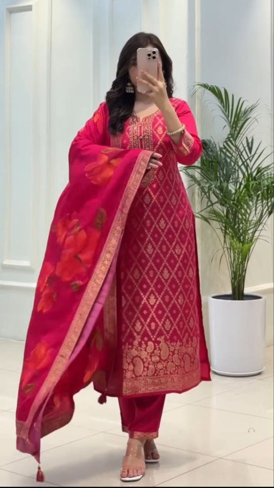 Person wearing a red traditional outfit with floral patterns indoors.